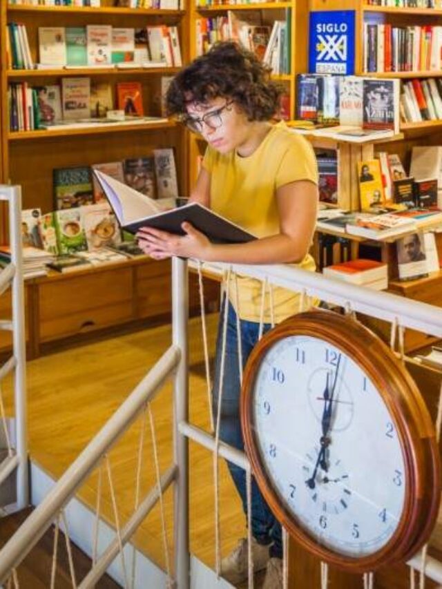 teen-girl-reading-near-clock (1)