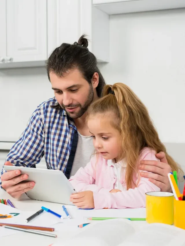 father-daughter-using-tablet